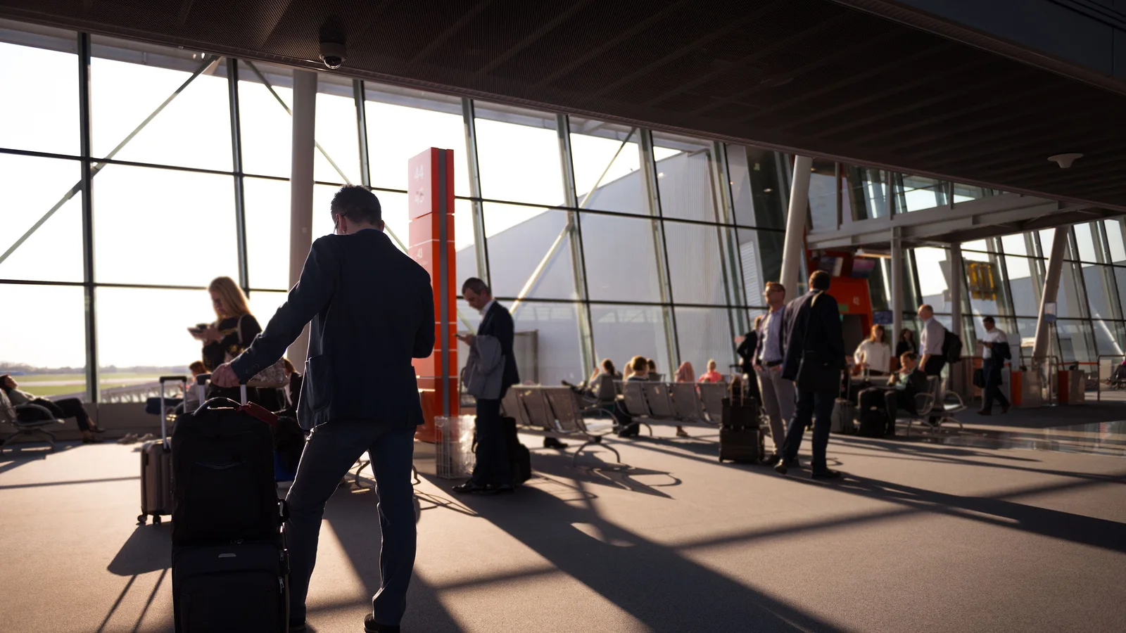 Travelers in a busy airport terminal