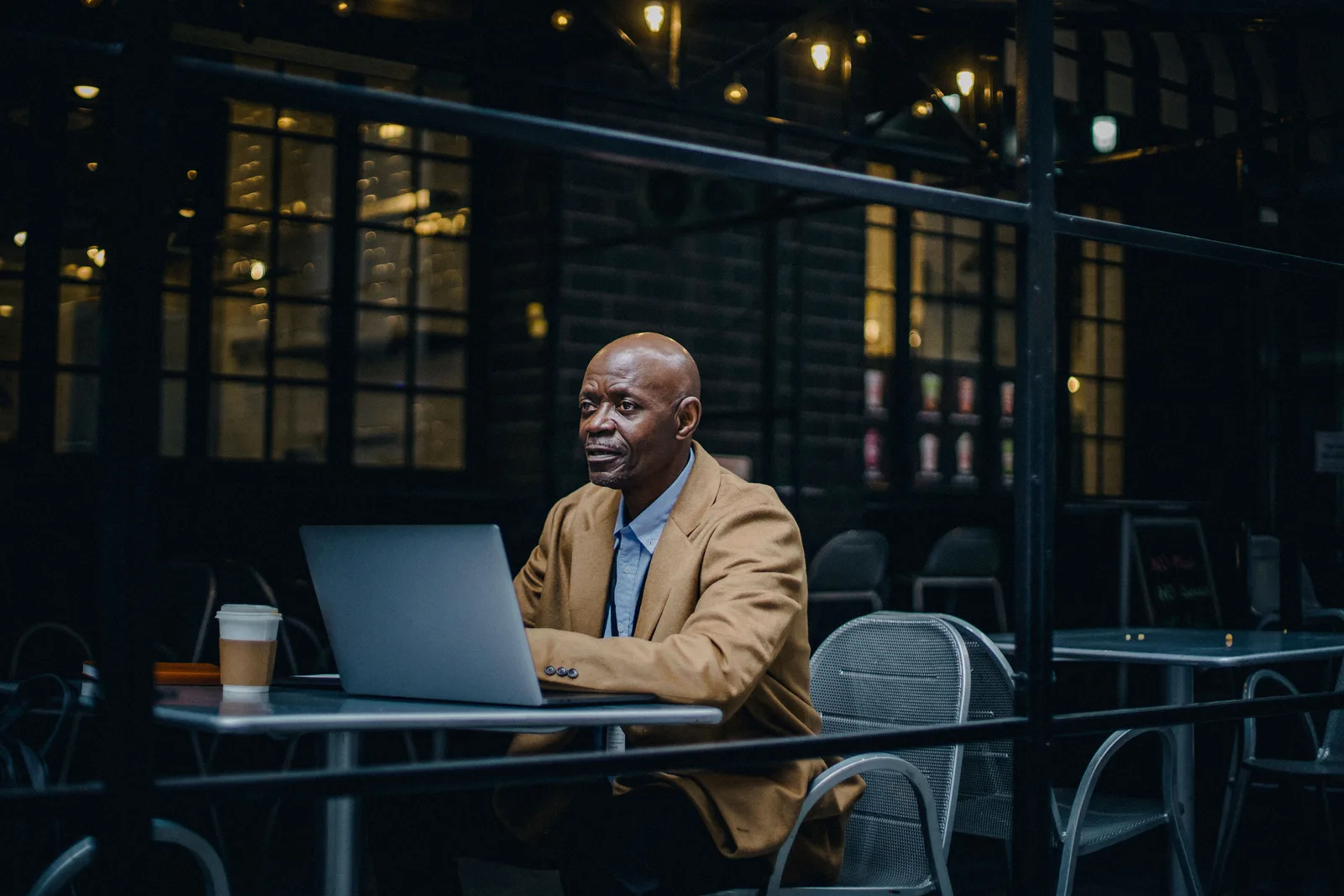 A remote worker typing on a laptop — the location-independent lifestyle that more than 50 countries now grant dedicated digital-nomad visas for.