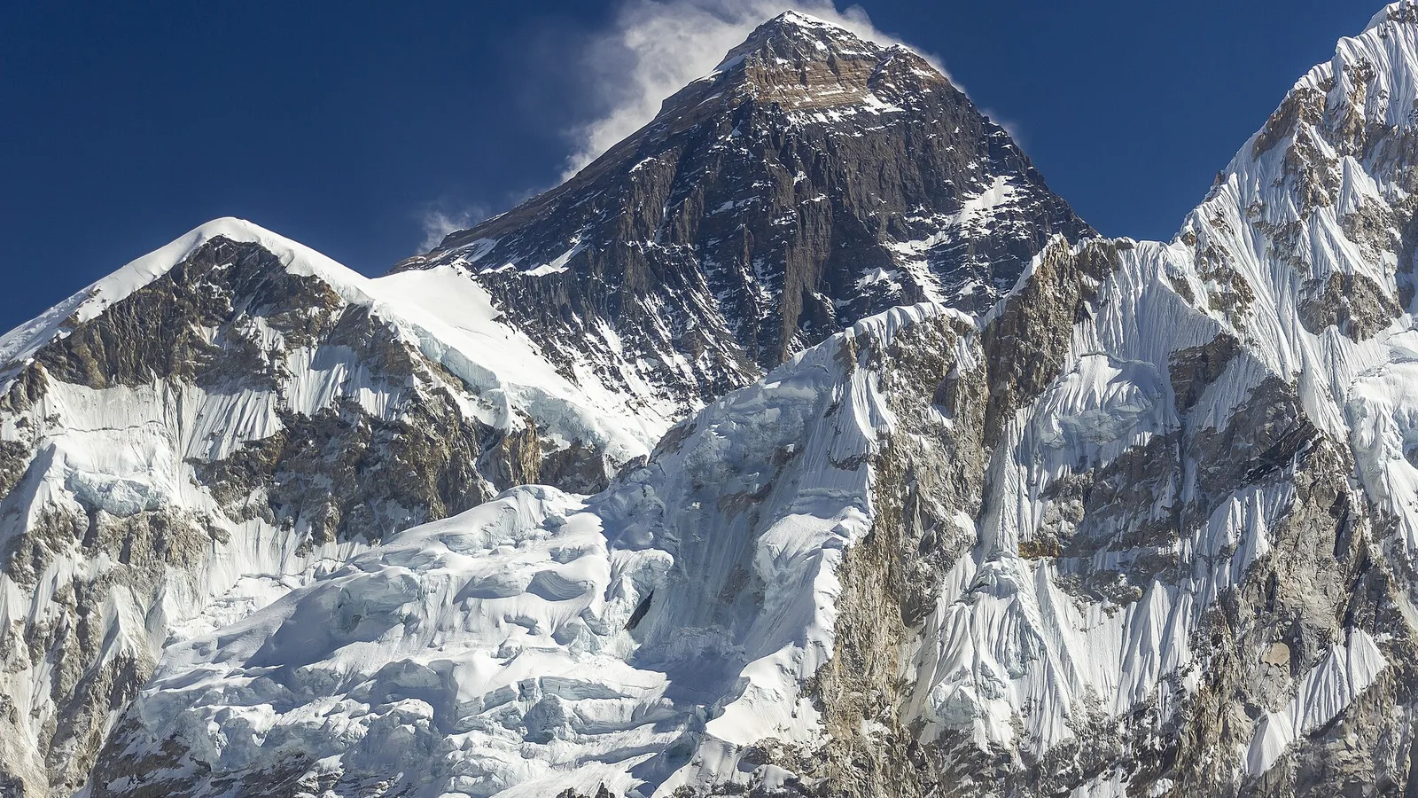 Mount Everest (8,849 m) and its summit pyramid rising above the Khumbu, Nepal — the mountain where the 2019 season’s deadly summit-day traffic jam formed in the death zone (a file image of the peak, not of the event)