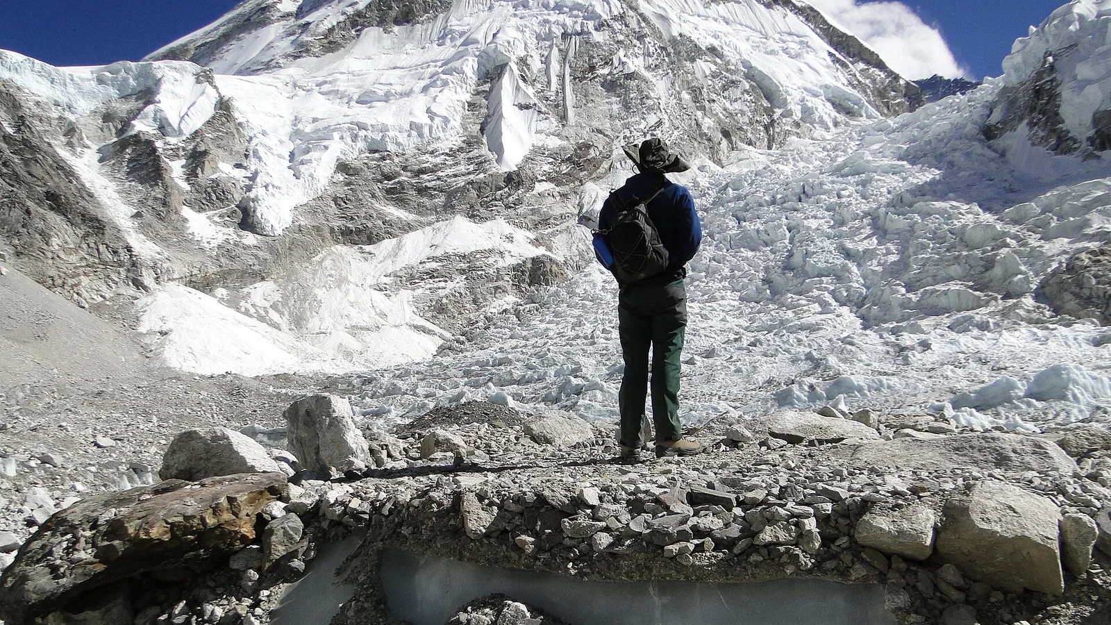 Mount Everest and the tents of a high-altitude expedition base camp in the Khumbu, Nepal — a guided climb of the mountain costs from about US$35,000 to well over US$100,000
