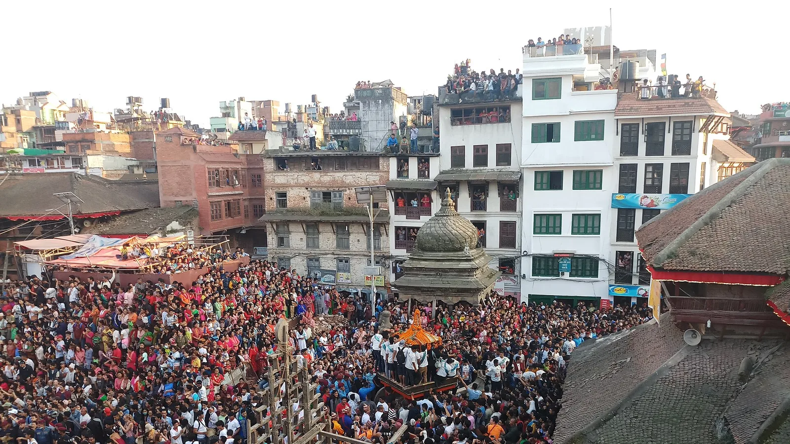 The Kumari chariot is pulled through crowds on Kathmandu Durbar Square during the Indra Jatra festival, Nepal