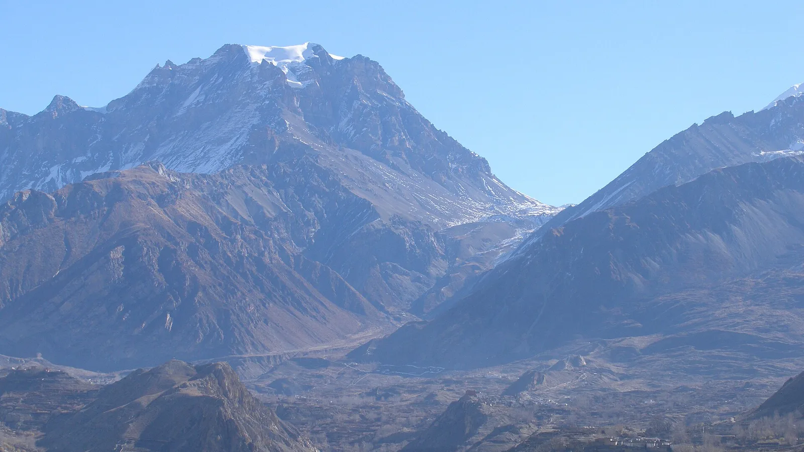 Trekkers on the Annapurna Circuit near Thorong La (5,416 m) above Manang, western Nepal — the Circuit runs the Marsyangdi and Kali Gandaki valleys on the far western side of the country, a separate river system from the flood-hit Rasuwa / Bhote Koshi corridor, so the trail itself was unaffected by the 2026 floods (only the Prithvi Highway road approach needs checking)