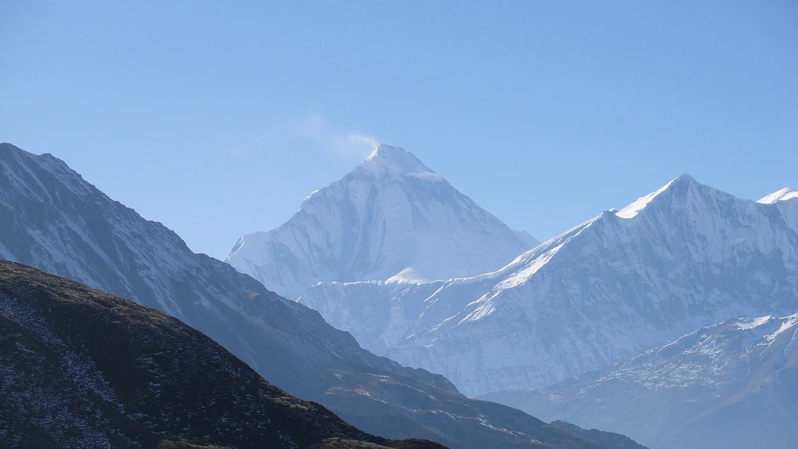 The grassy Khopra ridge (Khopra Danda) above the Kali Gandaki side of the Annapurna region, Nepal, with Dhaulagiri and the Annapurnas beyond — reached from Pokhara and unaffected by the 2026 Rasuwa flood