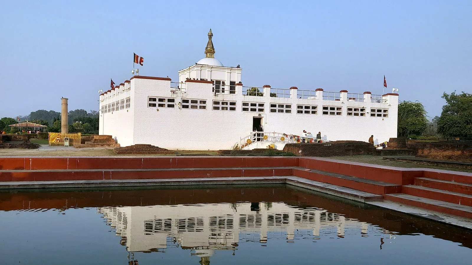 The Maya Devi Temple and sacred pond at Lumbini, the birthplace of the Buddha, in Rupandehi district of the far-southern Terai, Nepal — hundreds of km southwest of the flood-hit Rasuwa corridor and unaffected by the 2026 Rasuwa flood