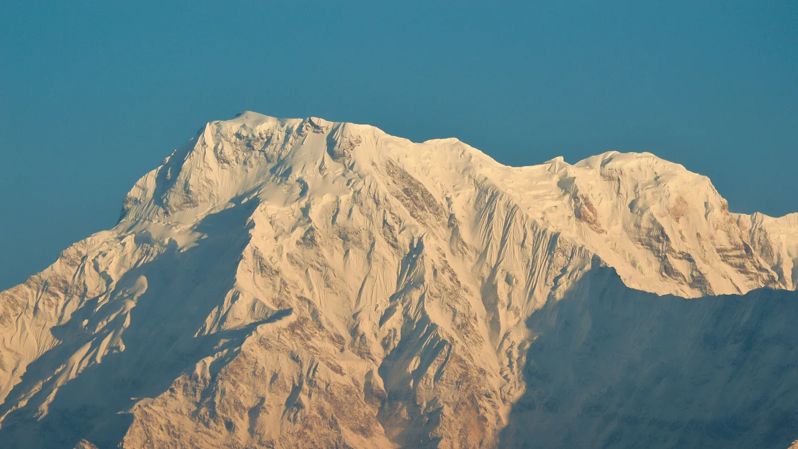 Annapurna I (8,091 m), the deadliest of the fourteen 8,000-metre peaks by fatality-to-summit ratio, rising above the Annapurna region of Nepal