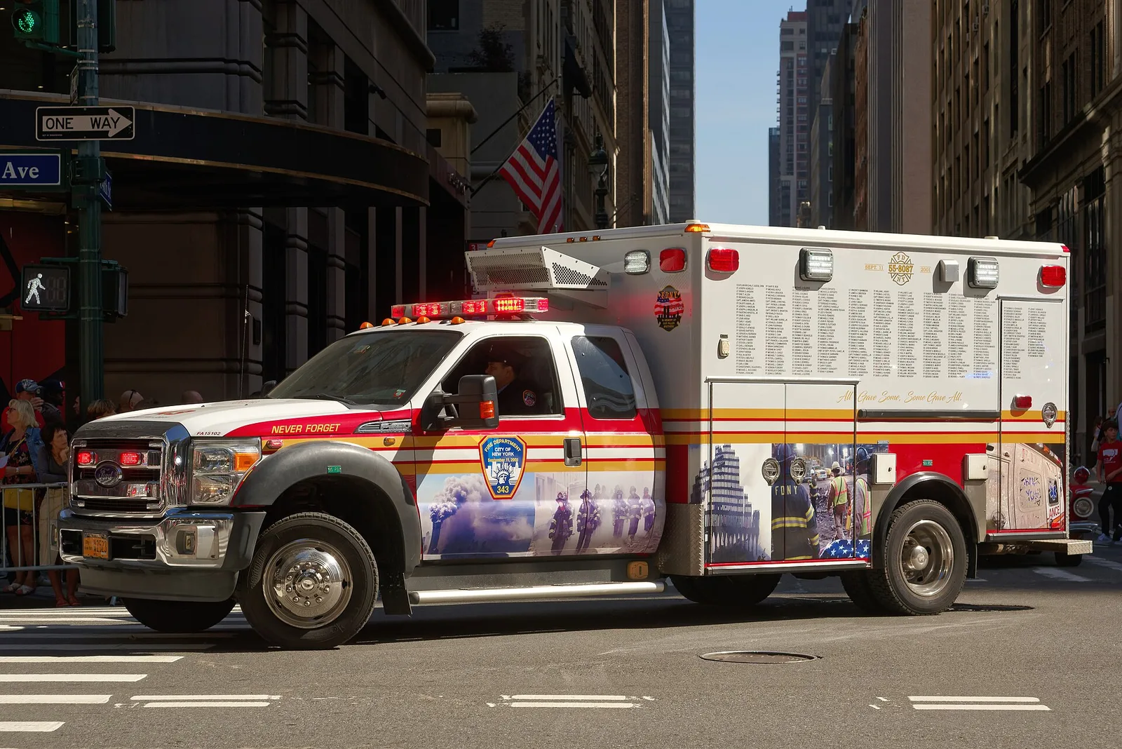 A New York City ambulance on a Manhattan street — emergency medical care in the USA can cost visiting travellers tens of thousands of dollars, 2026.