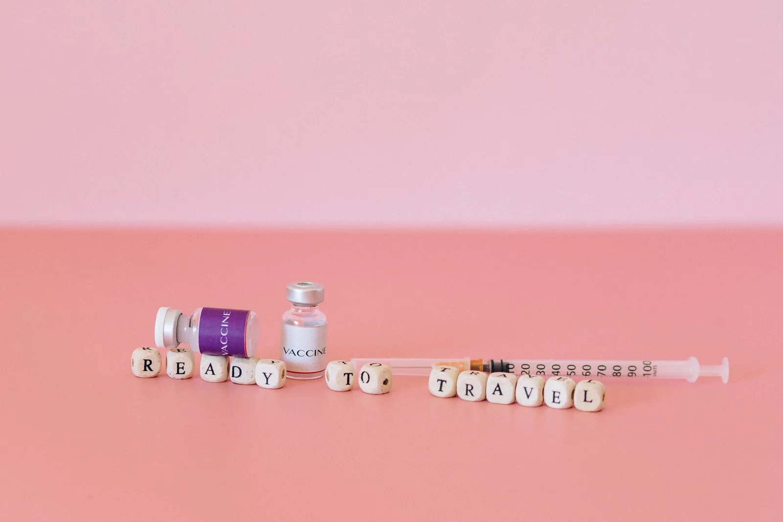 Labelled vaccine vials on a clinic surface — the pre-travel jabs discussed in this Nepal travel-health guide