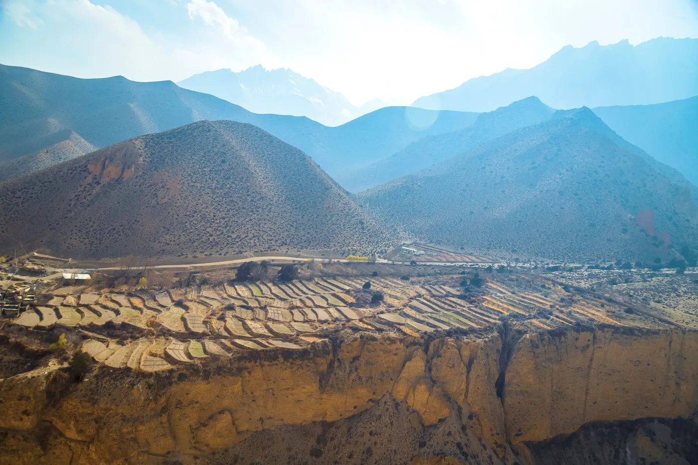 Desert canyons of Upper Mustang, Nepal's rain-shadow region, under clear summer skies