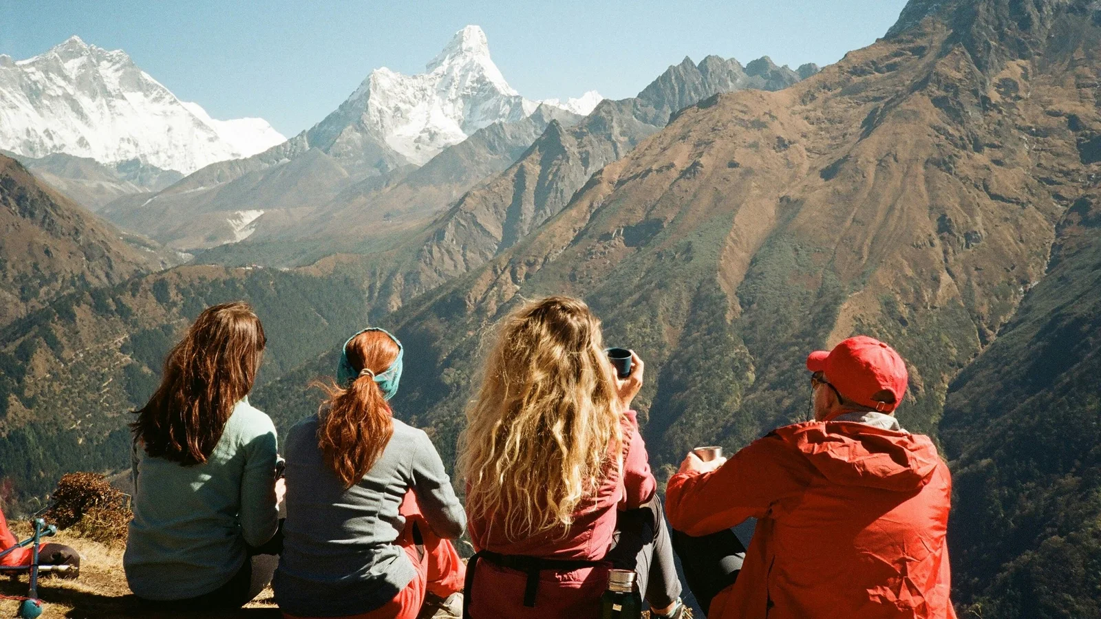 Group of hikers enjoying the stunning Himalayan view from Namche, Nepal.